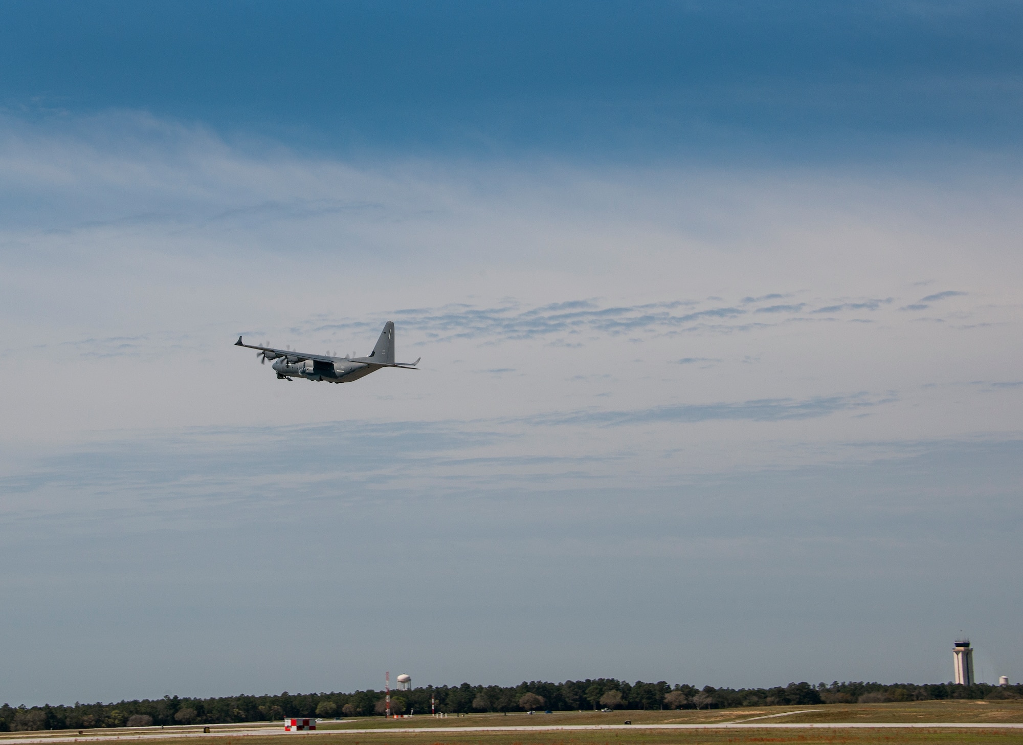A modified MC-130J lifts off from Eglin Air Force Base, Fla., for a test mission. The aircraft has been fitted with vertical fins on each wing, called winglets.  The 413th Flight Test Squadron aircrew and engineers tested the modified aircraft over eight flights.  The goal of the tests was to collect data on possible fuel efficiency improvements and performance with the winglets and lift distribution control system installed.  (U.S. Air Force photo/Samuel King Jr.)