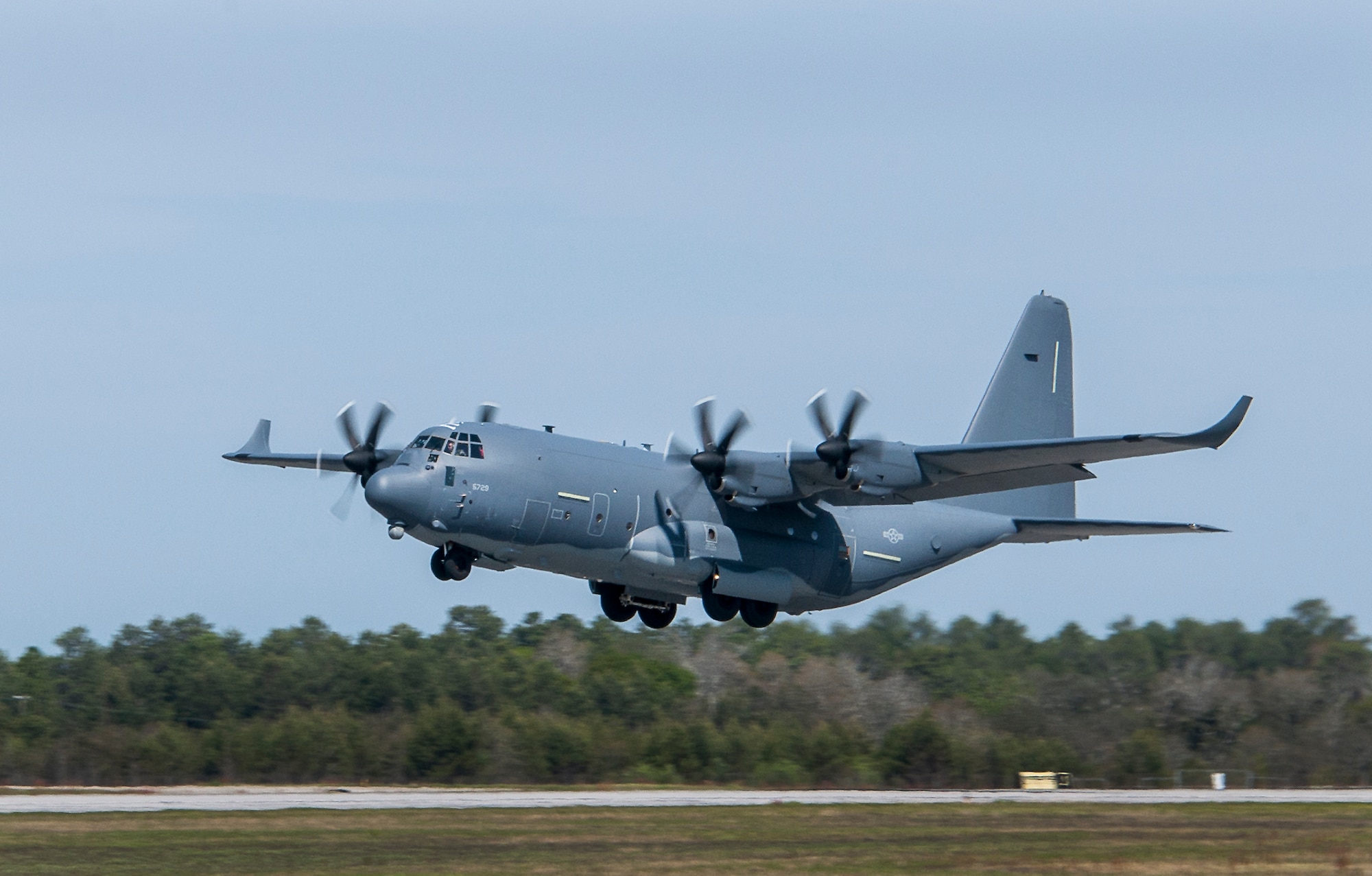 A modified MC-130J lifts off from Eglin Air Force Base, Fla., for a test mission. The aircraft has been fitted with vertical fins on each wing, called winglets.  The 413th Flight Test Squadron aircrew and engineers tested the modified aircraft over eight flights.  The goal of the tests was to collect data on possible fuel efficiency improvements and performance with the winglets and lift distribution control system installed.  (U.S. Air Force photo/Samuel King Jr.)