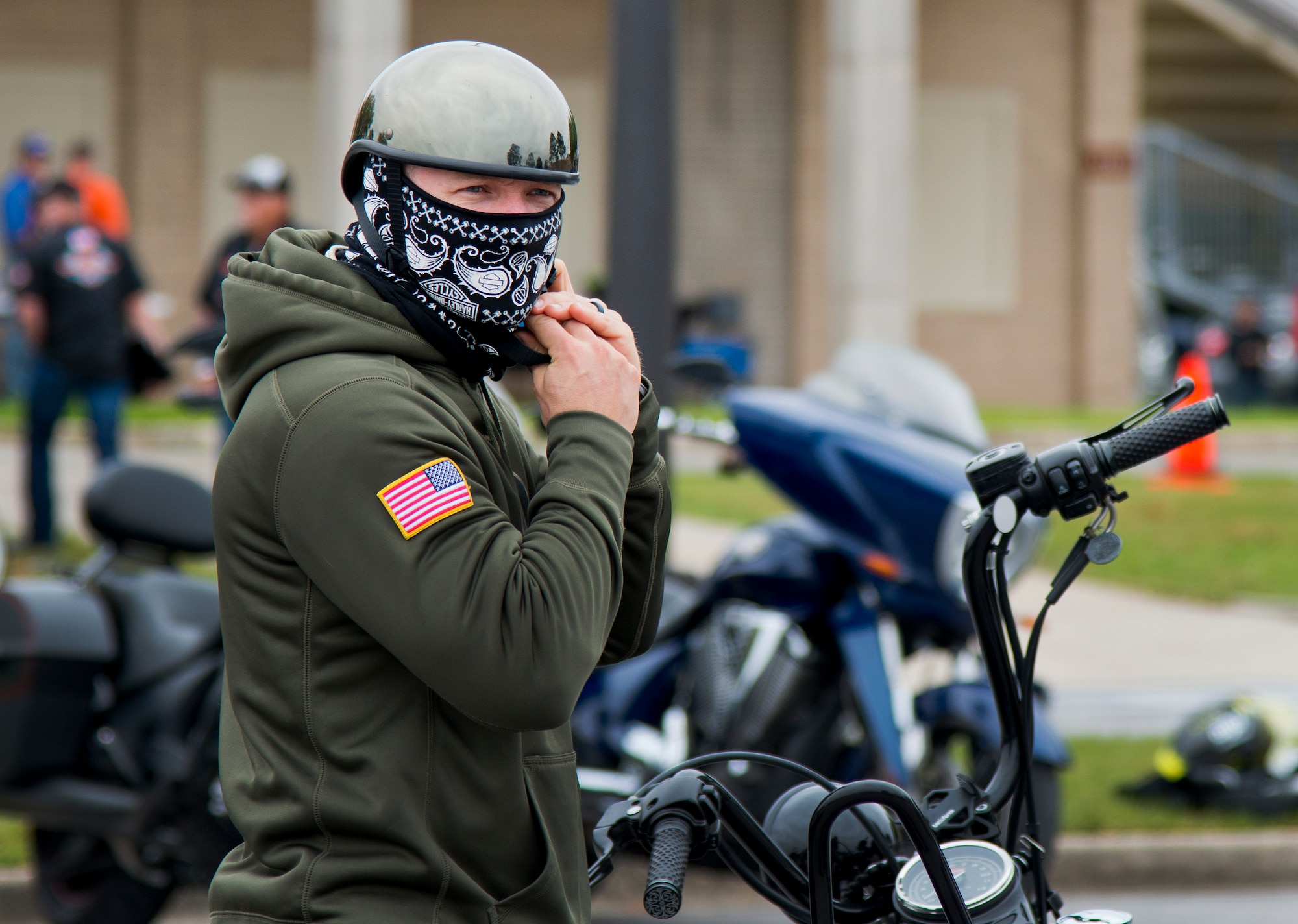 A biker gears up before a ride after the base’s annual motorcycle safety rally April 15 at Eglin Air Force Base, Fla.  More than 500 civilian and military riders rode in for the joint 53rd Wing/96th Test Wing event. (U.S. Air Force photo/Samuel King Jr.)