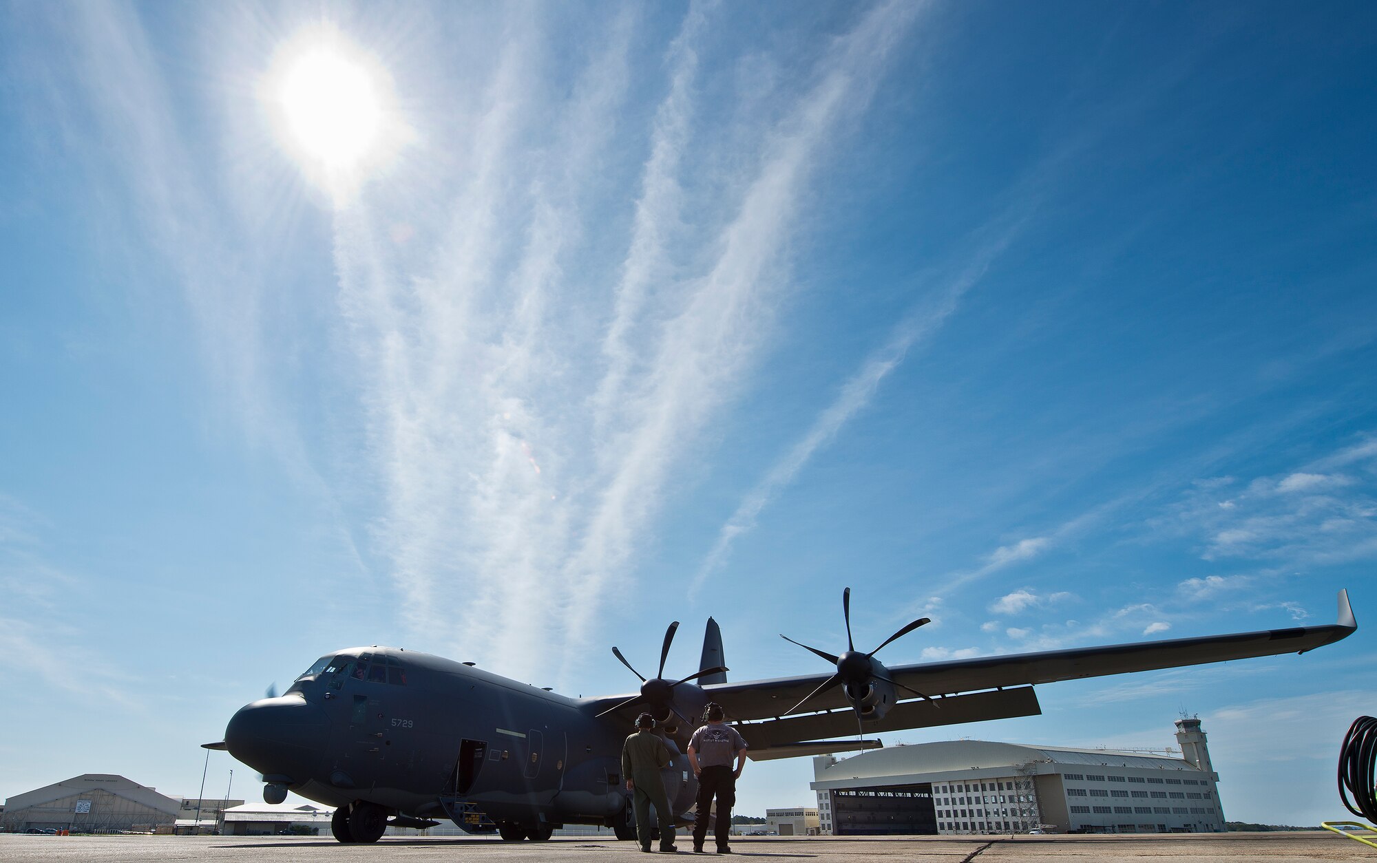 A maintainer and loadmaster watch as the MC-130J’s engine spins up prior to a mission at Eglin Air Force Base, Fla. The test aircraft has been fitted with vertical fins on each wing, called winglets.  The 413th Flight Test Squadron aircrew and engineers tested the modified aircraft over eight flights.  The goal of the tests was to collect data on possible fuel efficiency improvements and performance with the winglets and lift distribution control system installed.  (U.S. Air Force photo/Samuel King Jr.)