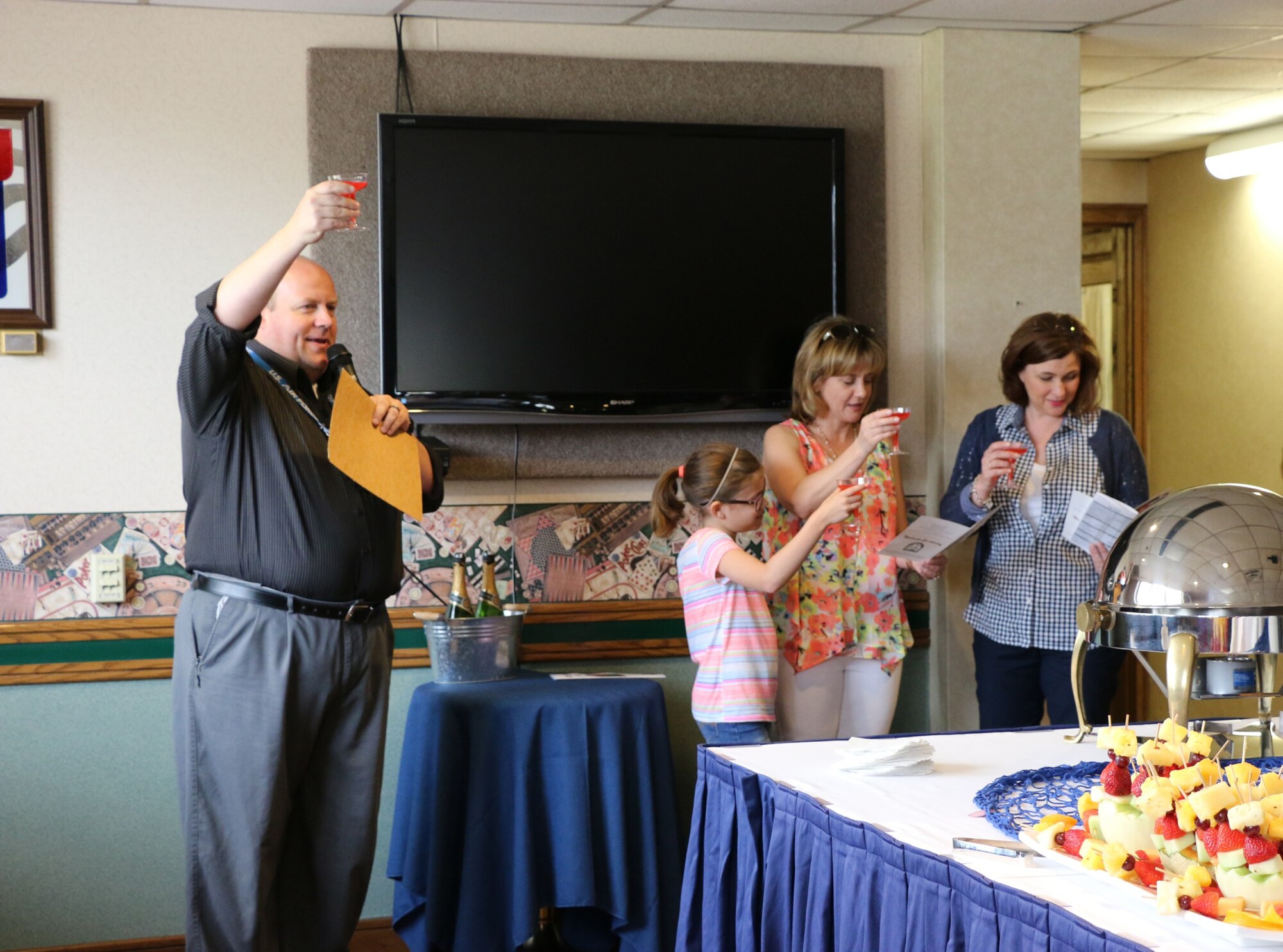 Boat Christening Ceremony Toast, left to right: Lyle Russell, AEDC Services Community Program Coordinator; AEDC Commander Col. Rodney Todaro’s daughter Audrey; Col. Todaro’s wife Karen; and Theresa Toth, wife of former AEDC commander, retired Col. Raymond Toth. (U.S. Air Force photo/Emily Howell)
