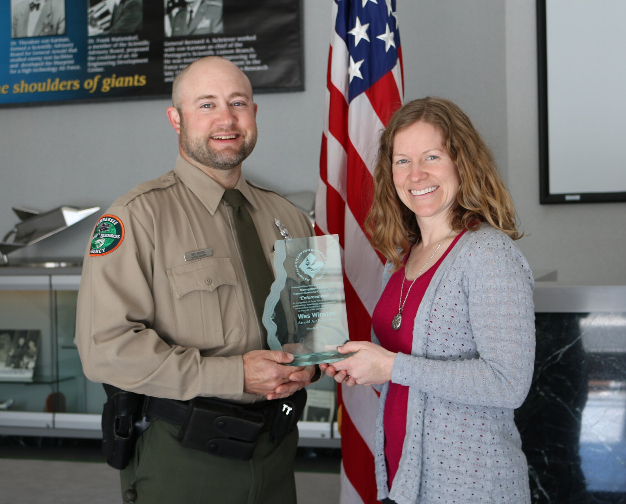 AEDC Wildlife Manager Wes Winton (left), with the Tennessee Wildlife Resources Agency, recently received the 2016 National Military Fish and Wildlife Association Award for law enforcement in support of the Natural Resource Conservation Management on Department of Defense lands. Winton is pictured with AEDC Natural Resource Manager Shannon Allen who nominated him for the award. (U.S. Air Force photo/Holly Fowler)