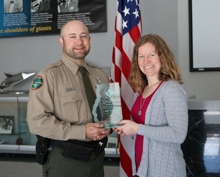 AEDC Wildlife Manager Wes Winton (left), with the Tennessee Wildlife Resources Agency, recently received the 2016 National Military Fish and Wildlife Association Award for law enforcement in support of the Natural Resource Conservation Management on Department of Defense lands. Winton is pictured with AEDC Natural Resource Manager Shannon Allen who nominated him for the award. (U.S. Air Force photo/Holly Fowler)