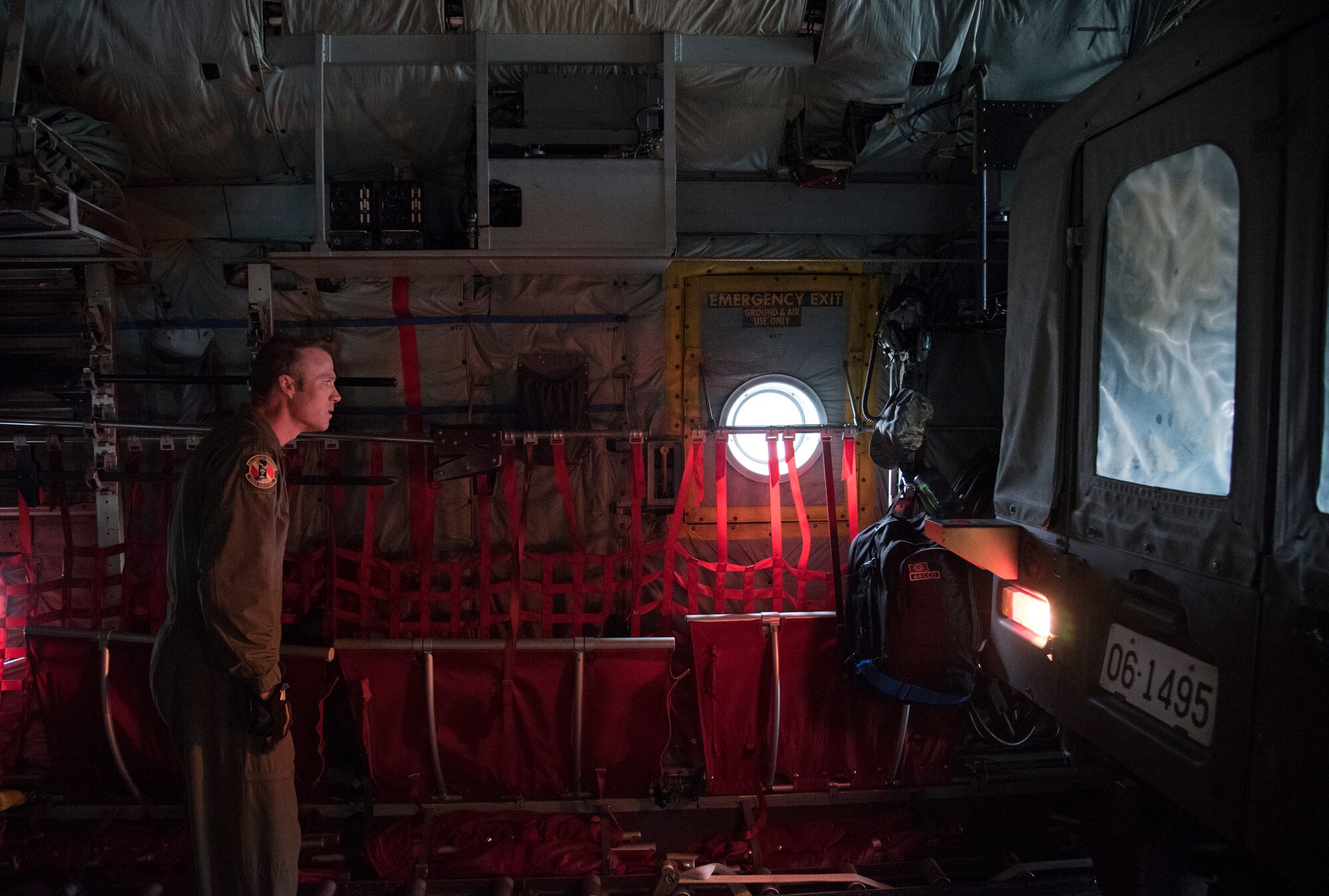 Master Sgt. Ryan Atkinson, 36th Airlift Squadron loadmaster, checks the clearance as a Japan Ground Self-Defense Force vehicle is backed into a C-130 Hercules at Chitose, Hokkaido, Japan, April 18, 2016. Regular joint exercises with the Government of Japan allowed U.S. forces to quickly assist JGSDF partners. (U.S. Air Force photo by Staff Sgt. Michael Washburn/Released)