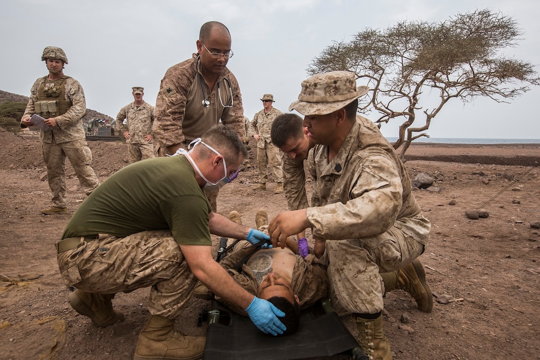 U.S. Marines and Sailors with the 13th Marine Expedtionary Unit conduct a casualty evacuation drill to maintain proficiency in Djibouti, Africa, Apr. 16, 2016. The 13th MEU is conducting sustainment training to maintain proficiency and combat readiness as part of the Boxer Amphibious Ready Group on a scheduled deployment to the Western Pacific area of responsibility. (U.S. Marine Corps photo by Cpl. Alvin Pujols/RELEASED)