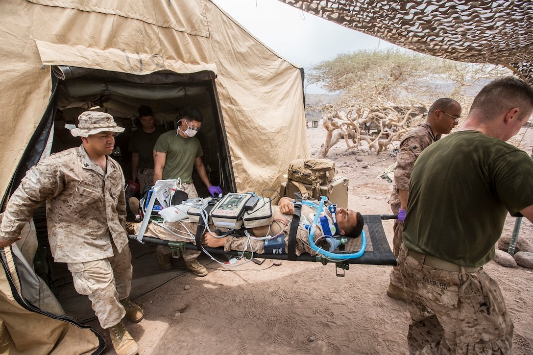 U.S. Marines and Sailors with the 13th Marine Expedtionary Unit conduct a casualty evacuation drill to maintain proficiency in Djibouti, Africa, Apr. 16, 2016. The 13th MEU is conducting sustainment training to maintain proficiency and combat readiness as part of the Boxer Amphibious Ready Group on a scheduled deployment to the Western Pacific area of responsibility. (U.S. Marine Corps photo by Cpl. Alvin Pujols/RELEASED)