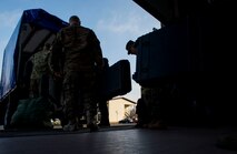 Airmen assigned to the 606th Air Control Squadron stow their luggage in a truck before a deployment in front of the 606th ACS main building at Spangdahlem Air Base, Germany, April 6, 2016. The 606th ACS sent an advanced echelon team to Aviano Air Base, Italy, to prepare for the transition after their deployed members return. (U.S. Air Force photo by Airman 1st Class Timothy Kim/Released)