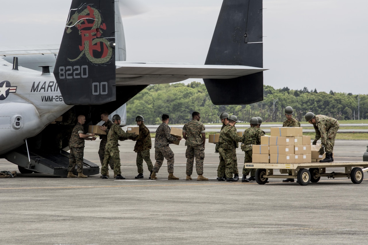 Marines with Marine Medium Tiltrotor Squadron (VMM) 265 (Reinforced), 31st Marine Expeditionary Unit, assists the Government of Japan in supporting those affected by recent earthquakes in Kumamoto, Japan, April 18, 2016. VMM-265 picked up supplies from Japan Ground Self-Defense Force Camp Takayubaru and delivered them to Hakusui Sports Park in the Kumamoto Prefecture. The long-standing relationship between Japan and the U.S. allows U.S. military forces in Japan to provide rapid, integrated support to the Japan Self-Defense Forces and civil relief efforts. (U.S. Marine Corps photos by Cpl. Nathan Wicks/Released)