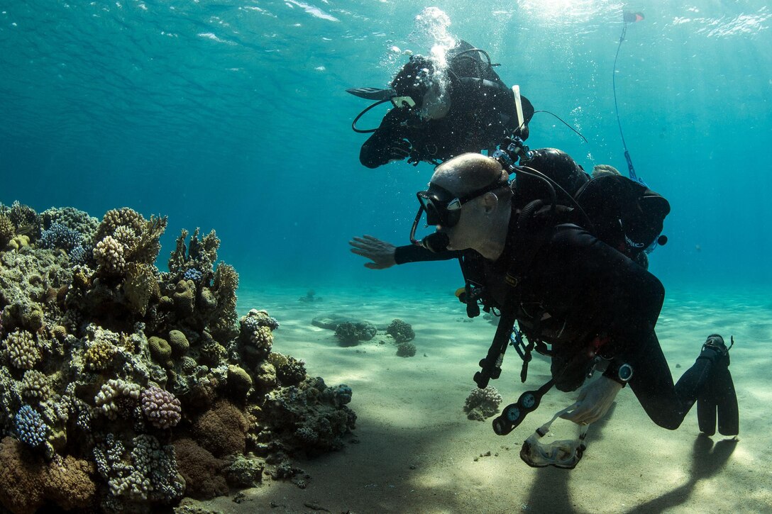 Navy Capt. Kyle Moses, left, and Master Chief Petty Officer Chris Borkenheim conduct pier inspections during International Mine Countermeasures Exercise 16 in Jordan, April 15, 2016. Moses and Borkenheim are the commodore and command master chief, respectively, of Commander, Task Force 56. Navy photo by Petty Officer 2nd Class Sean Furey