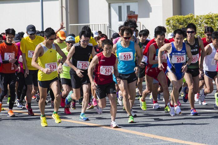 Station residents and Japanese participants begin a half marathon during the 49th Kintai Marathon on Marine Corps Air Station Iwakuni, Japan April 17, 2016. With more than 500 athletes, the marathon is one of the few events that invites Japanese citizens on the air station and provides a great opportunity for MCAS Iwakuni personnel to show support of their host nation through running, said Mai Tajima, SemperFit recreation specialist. The full marathon first place for the men was Yoshihisa Nagashita, 34, completing at 2 hours, 40 minutes, 21 seconds, and for the women was Hitomi Matsubara, 45, completing at 3:27:25. (U.S. Marine Corps photo by Cpl. Nathan D. Wicks /Released)