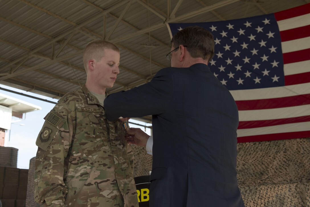 Defense Secretary Ash Carter awards one of the first five Operation Inherent Resolve medals to a service member during a ceremony in Baghdad, April 18, 2016. DoD photo by U.S. Air Force Senior Master Sgt. Adrian Cadiz