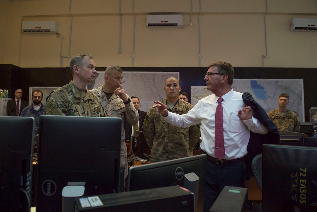Defense Secretary Ash Carter, right, speaks with Army Lt. Gen. Sean MacFarland, commander of Combined Joint Task Force Operation Inherent Resolve, as they tour OIR headquarters in Baghdad, April 18, 2016. DoD photo by U.S. Air Force Senior Master Sgt. Adrian Cadiz