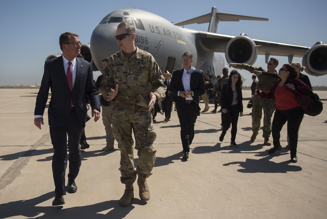 Defense Secretary Ash Carter, left, walks with U.S. Army Lt. Gen. Sean MacFarland, commander of Combined Joint Task Force Operation Inherent Resolve, upon Carter's arrival in Baghdad, April 18, 2016. DoD photo by U.S. Air Force Senior Master Sgt. Adrian Cadiz