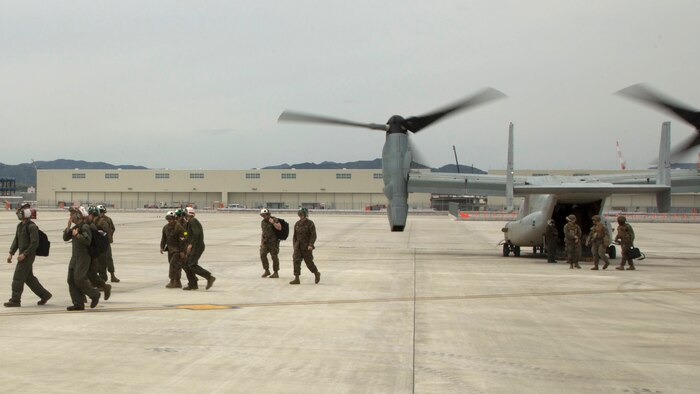 Marines with the 31st Marine Expeditionary Unit disembark MV-22B Ospreys with Marine Medium Tiltrotor Squadron 265 (Reinforced), 31st MEU at Marine Corps Air Station Iwakuni, Japan to support the Japan Ground Self Defense Force with relief efforts after a series of earthquakes struck the island of Kyushu April 18, 2016. The Government of Japan requested assistance for the JGSDF in the relief effort.