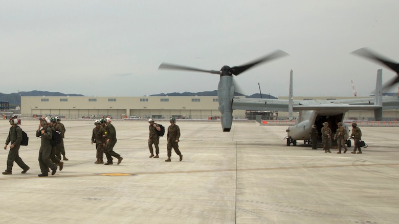 Marines with the 31st Marine Expeditionary Unit disembark MV-22B Ospreys with Marine Medium Tiltrotor Squadron 265 (Reinforced), 31st MEU at Marine Corps Air Station Iwakuni, Japan to support the Japan Ground Self Defense Force with relief efforts after a series of earthquakes struck the island of Kyushu April 18, 2016. The Government of Japan requested assistance for the JGSDF in the relief effort.