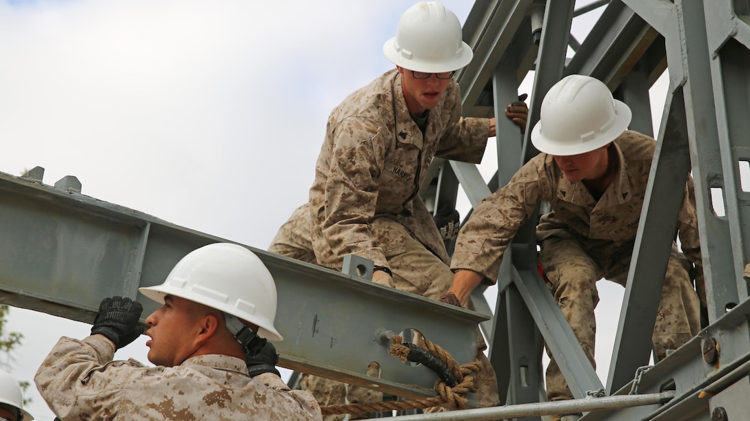 Marines with 7th Engineer Support Battalion, I Marine Logistics Group, position a transom while building a bridge at Marine Corps Base Camp Pendleton, California, April 13, 2016. Nearly 25 Marines worked on the three-week project. 