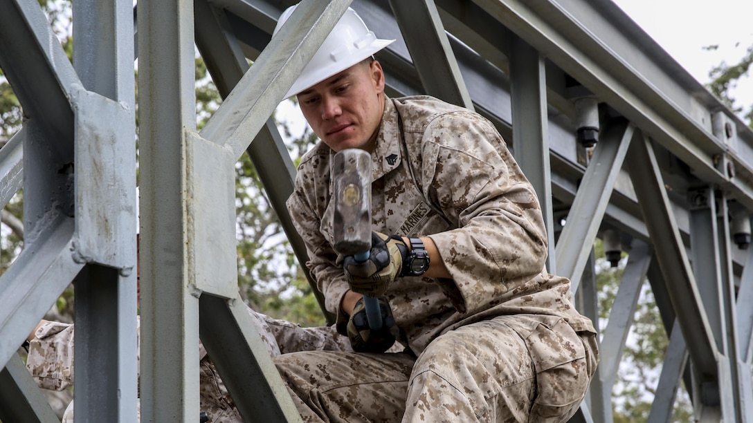 Sgt. Chris Piette helps construct a bridge at Marine Corps Base Camp Pendleton, California, April 13, 2016. Piette is a combat engineer with 7th Engineer Support Battalion, I Marine Logistics Group, and is a De Pere, Wisconsin native. Bailey bridge was originally designed during World War II and was one of the most critical engineering components of that time. 