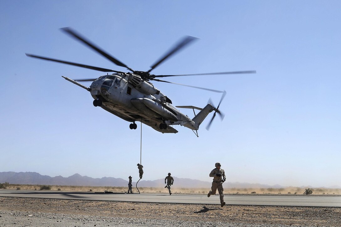 Marines conduct a fast-rope exercise from a CH-53E Super Stallion helicopter in Yuma, Ariz., April 1, 2016. The Marines are assigned to 3nd Battalion, 6th Marine Regiment, 2nd Marine Division, 2nd Marine Expeditionary Force. The course provides standardized advanced tactical training and certification of unit instructor qualifications to support Marine aviation training and readiness and assists in developing and employing aviation weapons and tactics. Marine Corps photo by Staff Sgt. Artur Shvartsberg