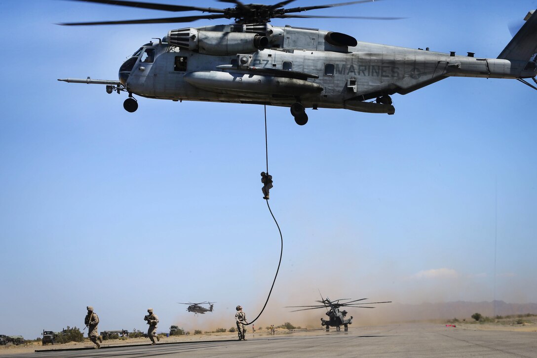 Marines participate in a fast-rope exercise from a CH-53E Super Stallion helicopter in Yuma, Ariz., April 1, 2016. Marine Corps photo by Staff Sgt. Artur Shvartsberg  