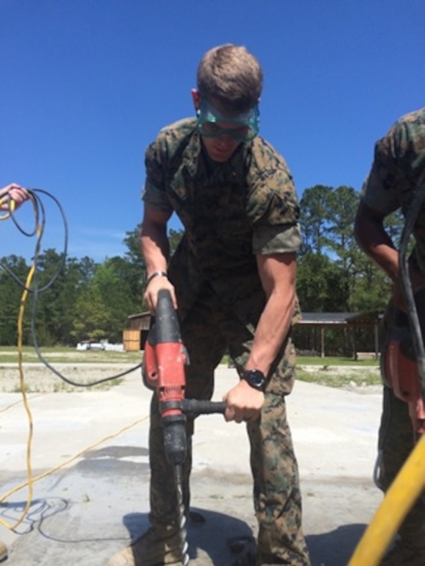 On April 14, 2016 Second Lieutenant Thomas Cofer, a Marine attached to Combat Engineer Officer Course 5-16 (CEO 5-16); uses a hammer drill, a tool within the Airfield Damage Repair (ADR) kit; to break up concrete around a spall.  Spall repair is an expedient method of repairing runway damage that has not broken through the runway surface.
