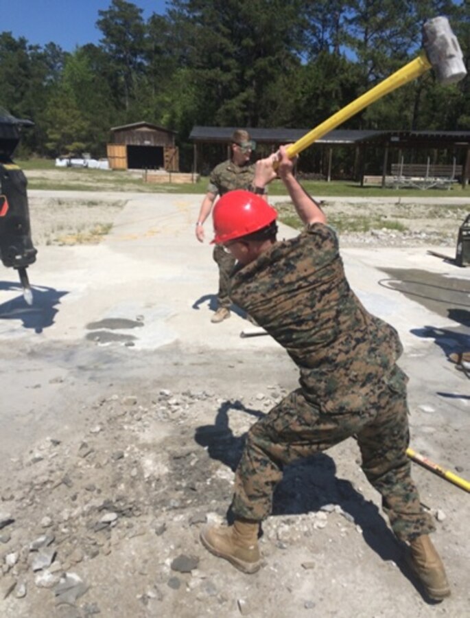 On April 14, 2016 First Lieutenant Jonathan Lanning Keller, a Marine attached to Combat Engineer Officer course 5-16 (CEO 5-16); uses a sledgehammer to break up a spall in the concrete as part of an Airfield Damage Repair (ADR) practical application. Spalls are broken up to ensure that Pavemend concrete will be able to adequately fill the spall without leaving pockets.
