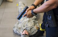 Officers from the Scottsdale Police Department capture a role-playing active shooter during a training exercise with U.S. Army Reserve Soldiers at a training center in Scottsdale, Arizona, April 9. Roughly 150 soldiers were included in the training exercise from various units, to include the 387th Military Police Battalion, the 387th Engineer Battalion and the 91st Operations Training Division. (U.S. Army photo by Sgt. Jennifer Spiker)