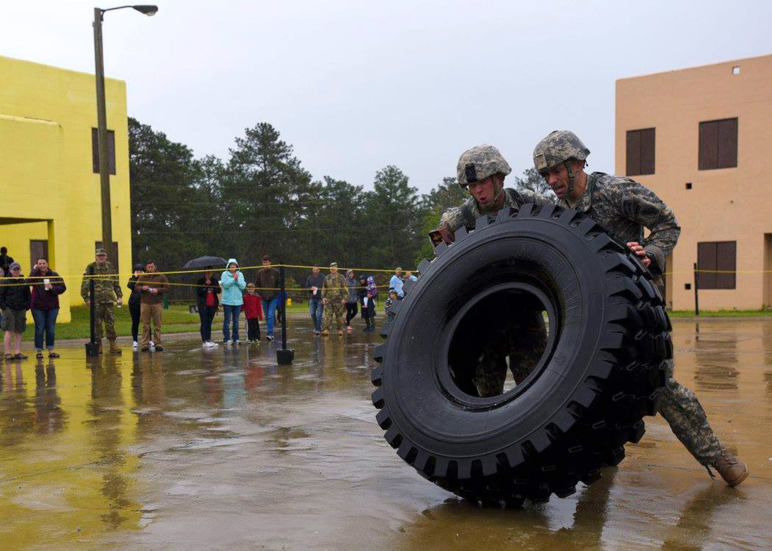 Army Staff Sgt. Erich Friedlein, left, with the Pennsylvania Army National Guard, and his teammate, Army Capt. Robert Killian, with the Colorado Army National Guard, work together to move a large truck tire while competing in the 2016 Lt. Gen. David E. Grange Jr. Best Ranger Competition at Fort Benning, Georgia. The two took first place in the grueling three-day competition that tests competitors on a variety of tactical and technical tasks in a physically and mentally demanding environment, marking the first time an Army Guard team has won in the competition’s 33-year history. 