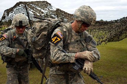 Army Capt. Robert Killian, right, with the Colorado Army National Guard, and his teammate, Army Staff Sgt. Erich Friedlein, with the Pennsylvania Army National Guard, head out to their next event while competing in the 2016 Lt. Gen. David E. Grange Jr. Best Ranger Competition at Fort Benning, Georgia. 