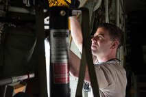 Senior Airman Blaine Miller goes through post-flight inspections of a C-130 at Aviano AB, Italy, in support of Exercise Saber Junction. (U.S. Air Force photo by Staff Sgt. Trevor Saylor)