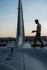 Senior Airman Blaine Miller goes through post-flight inspections of a C-130 at Aviano AB, Italy, in support of Exercise Saber Junction. (U.S. Air Force photo by Staff Sgt. Trevor Saylor)