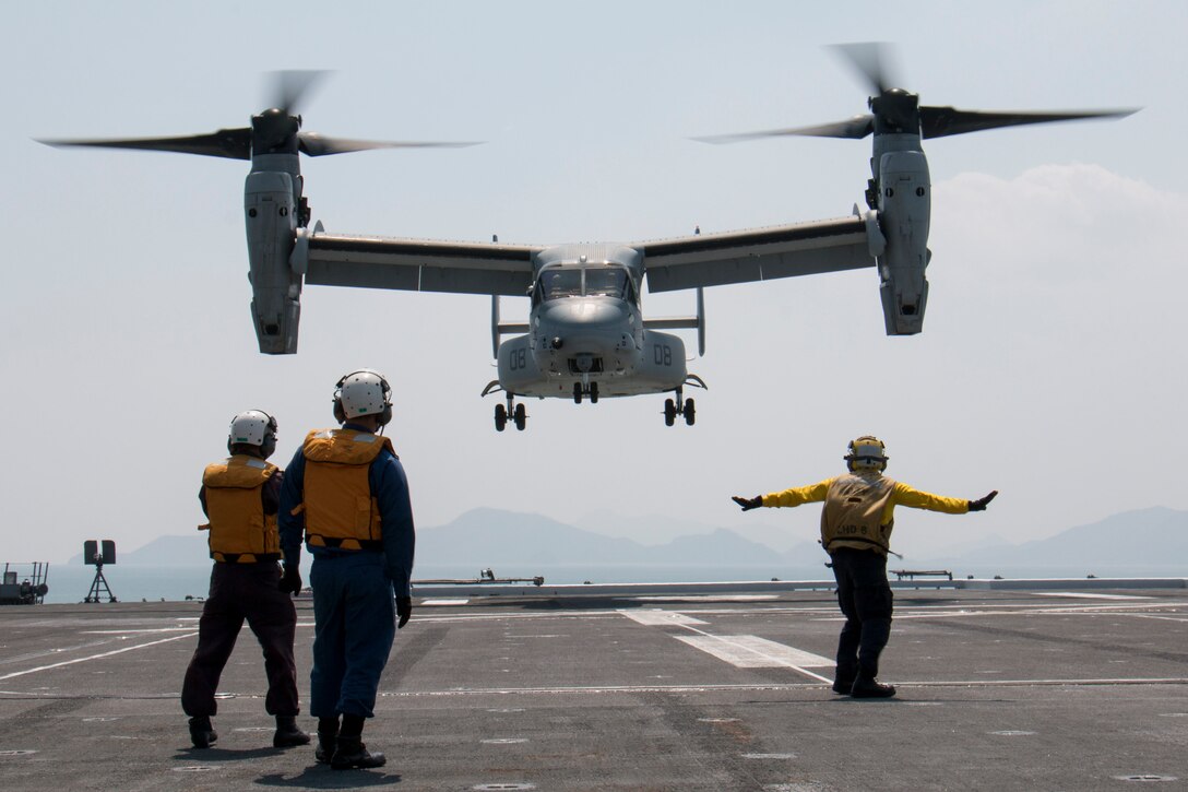A U.S. Marine Corps MV-22B Osprey lands aboard the JS Hyuga while supporting Japan's earthquake relief efforts near Kumamoto, April 19, 2016. The Osprey is assigned to Marine Medium Tiltrotor Squadron 265, 31st Marine Expeditionary Unit. Navy photo by Petty Officer 3rd Class Gabriel B. Kotico