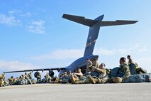 U.S. Army Paratroopers of the 173rd Airborne Brigade wait to board a Charleston C-17 Globemaster III during large-scale airborne operations at Exercise Saber Junction 16 on the Maneuver Rights Area near Hohenfels, Germany, April 12, 2016. Over 1000 paratroopers and multiple Container Delivery Systems bundles were deployed to provide initial logistical support for follow on missions. Saber Junction 16 will evaluate and assess the readiness of the U.S. Army's 173rd Airborne Brigade to conduct land operations in a joint, combined environment and to promote interoperability with participating Allied and partner nations. Countries participating in the exercise include Albania, Armenia, Bosnia and Herzegovina, Bulgaria, Hungary, Italy, Latvia, Lithuania, Macedonia, Moldova, Romania, Serbia, Slovenia, Sweden, the United Kingdom and the United States. (U.S. Army photo by Visual Information Specialist Gertrud Zach)