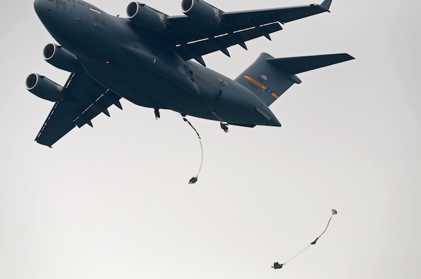 Charleston Reservists flying a C-17 Globemaster III drop U.S. Army Paratroopers of the 173rd Airborne Brigade, and the British Army’s 16 Air Assault Brigade during large-scale airborne operations at Exercise Saber Junction 16 on the Maneuver Rights Area near Hohenfels, Germany, April 12, 2016. Over 1000 paratroopers and multiple Container Delivery Systems bundles were deployed to provide initial logistical support for follow on missions. Saber Junction 16 will evaluate and assess the readiness of the U.S. Army's 173rd Airborne Brigade to conduct land operations in a joint, combined environment and to promote interoperability with participating Allied and partner nations. Countries participating in the exercise include Albania, Armenia, Bosnia and Herzegovina, Bulgaria, Hungary, Italy, Latvia, Lithuania, Macedonia, Moldova, Romania, Serbia, Slovenia, Sweden, the United Kingdom and the United States. (U.S. Army photo by Visual Information Specialist Gertrud Zach/released)