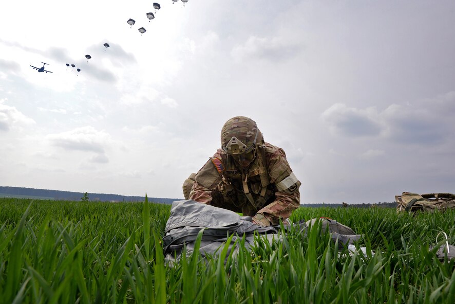 Charleston Reservists flying a C-17 Globemaster III drop U.S. Army Paratroopers of the 173rd Airborne Brigade, and the British Army’s 16 Air Assault Brigade during large-scale airborne operations at Exercise Saber Junction 16 on the Maneuver Rights Area near Hohenfels, Germany, April 12, 2016. Over 1000 paratroopers and multiple Container Delivery Systems bundles were deployed to provide initial logistical support for follow on missions. Saber Junction 16 will evaluate and assess the readiness of the U.S. Army's 173rd Airborne Brigade to conduct land operations in a joint, combined environment and to promote interoperability with participating Allied and partner nations. Countries participating in the exercise include Albania, Armenia, Bosnia and Herzegovina, Bulgaria, Hungary, Italy, Latvia, Lithuania, Macedonia, Moldova, Romania, Serbia, Slovenia, Sweden, the United Kingdom and the United States. (U.S. Army photo by Visual Information Specialist Gertrud Zach)