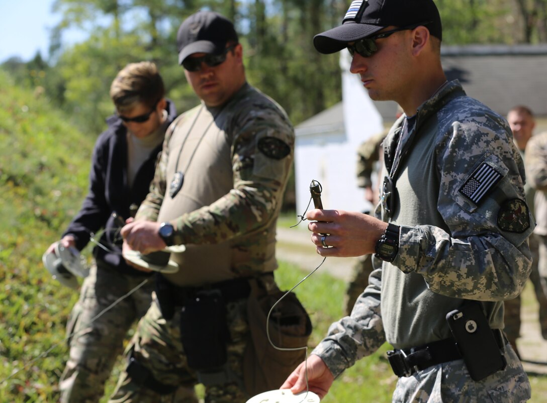 Members of the Carteret County Special Response Team prepare to detonate explosives on a range at Marine Corps Air Station Cherry Point, N.C., April 13, 2016. The team used C-4, TNT and dynamite in the demonstration. The training was meant to help the Carteret County SRT understand how to handle situations dealing with these explosives. The team completed training in the morning with Cherry Point’s Explosive Ordnance Disposal Marines before testing their knowledge at the range. This is the first time the team has done training with Cherry Point’s EOD unit. (U.S. Marine Corps photo by Lance Cpl. Mackenzie Gibson/ Released)