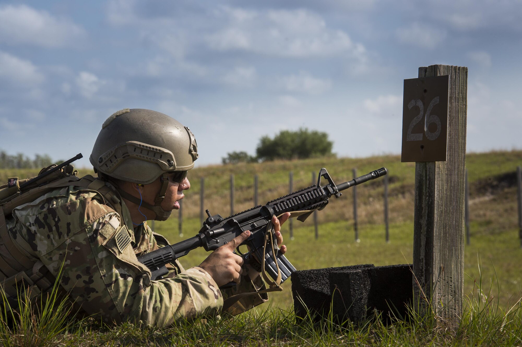 U.S. Air Force Senior Airman Altus Menifee, 13th Air Support Operations Squadron checks his weapon during Spartan Warrior week, April 14, 2015, at Avon Park Air Force Range, Fla. Spartan Warrior is an annual combat readiness exercise hosted by the 93d AGOW which brings together battlefield Airmen from 20 geographically separated units (U.S. Air Force photo by Senior Airman Ryan Callaghan/Released)
