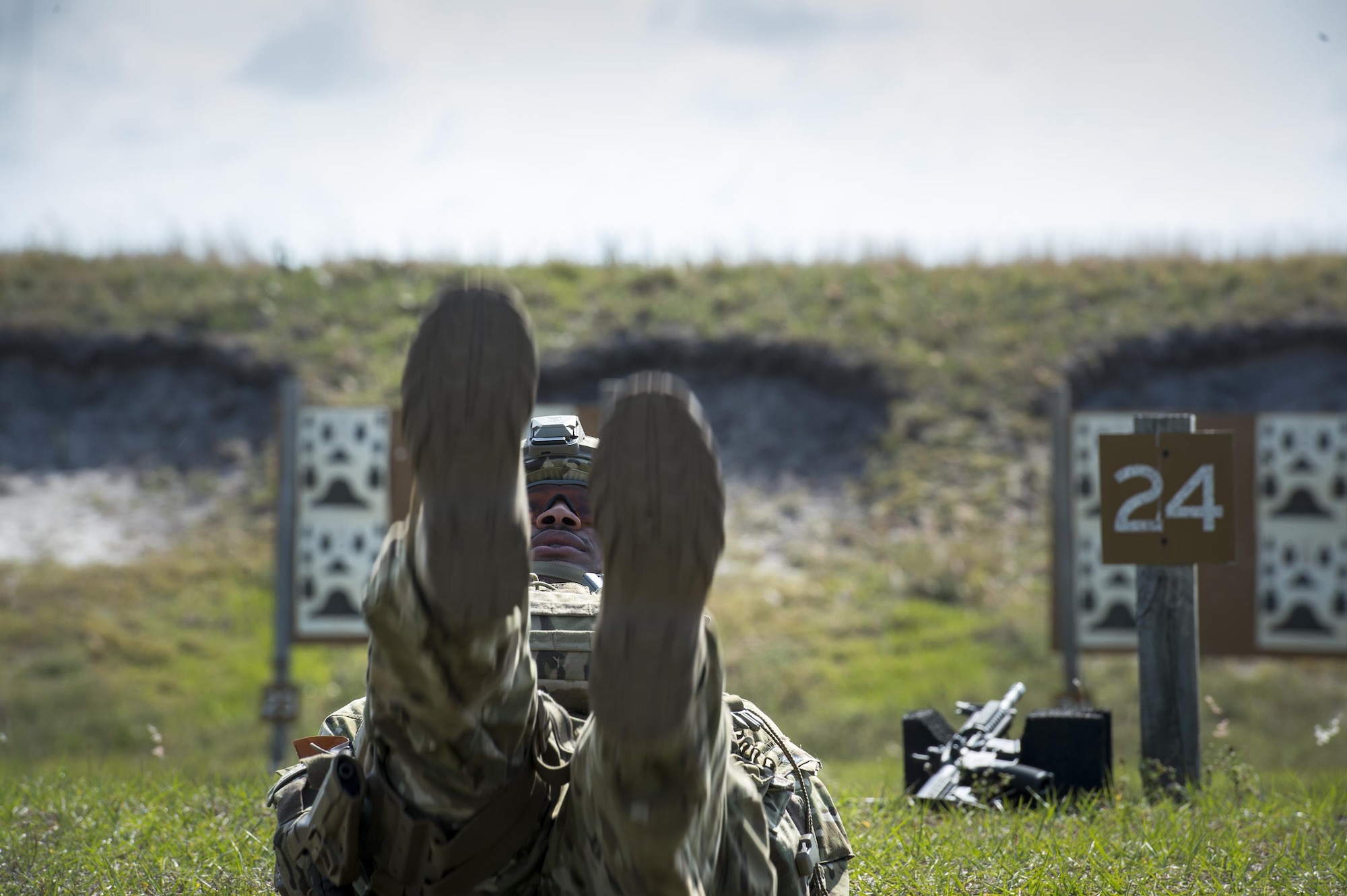 A U.S. Air Force Airman from the 13th Air Support Operations Squadron performs flutter kicks during Spartan Warrior week, April 14, 2015, at Avon Park Air Force Range, Fla. Spartan Warrior is an annual combat readiness exercise hosted by the 93d AGOW which brings together battlefield Airmen from 20 geographically separated units (U.S. Air Force photo by Senior Airman Ryan Callaghan/Released)