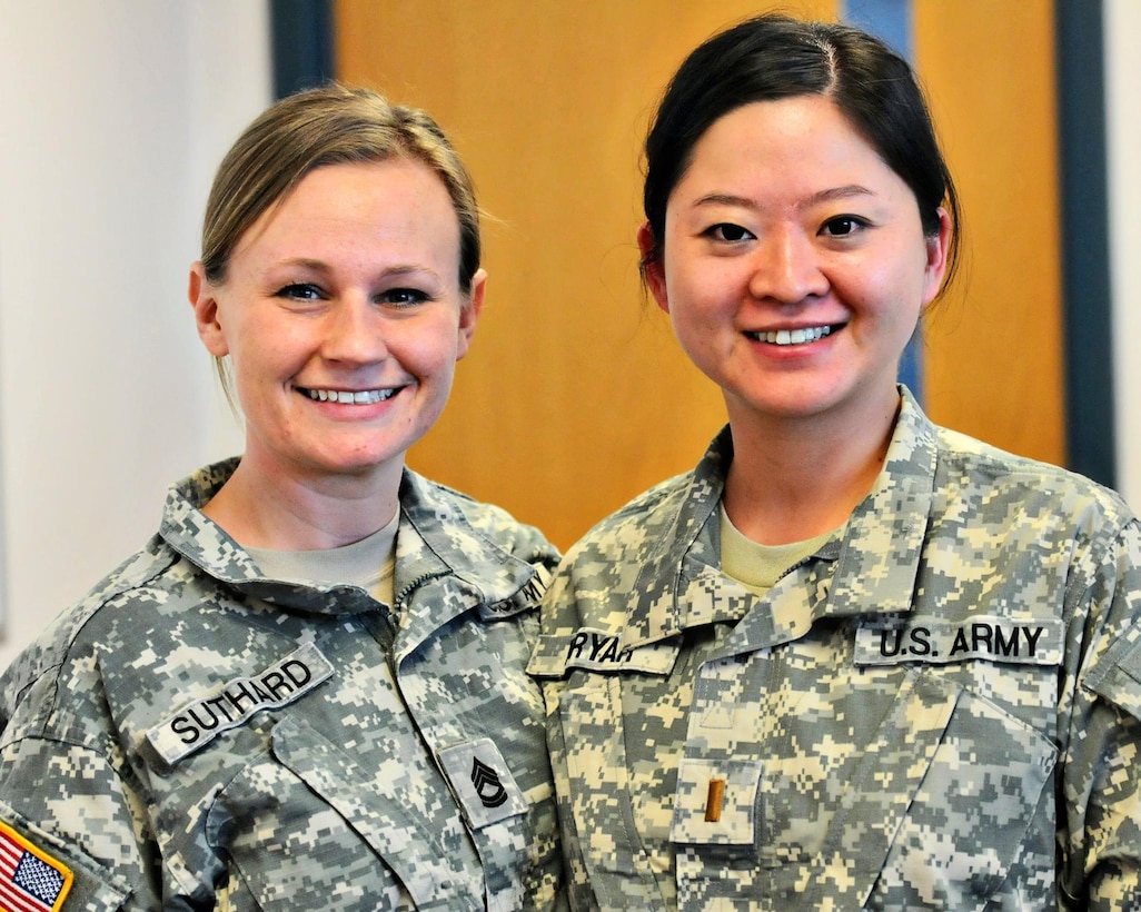 Sgt. 1st Class Nicole Suthard, Internal Review Sergeant, left, and 2nd Lt. Jiaru Bryar, Internal Review Evaluator, right, pause for a photo during the command's April battle assembly. The battle assembly was Bryar's first since her return graduating from Basic Officer Leaders Course (BOLC).
(Photo by Spc. David Lietz)