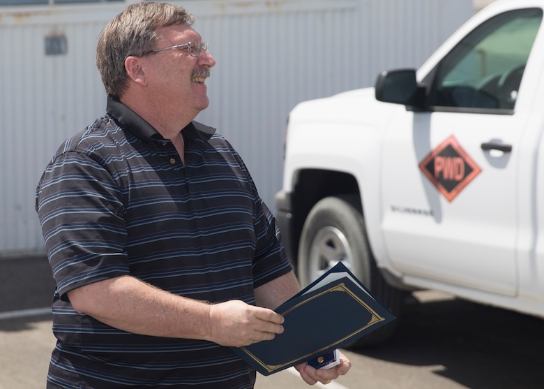 Ricky Brennan, contract surveillance representative, Public Works Division, speaks to ceremony attendees after receiving the Federal Length of Service Award at the Combat Center’s Public Works Division, April 6, 2016.  (Official Marine Corps photo by Cpl. Connor Hancock/Released)