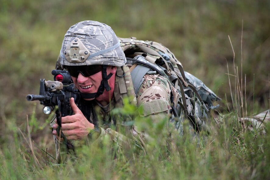 U.S. Air Force Staff Sgt. James Jackson, 823d Base Defense Squadron support NCO in charge, provides cover for Airmen during Spartan Warrior week, April 15, 2016, at Avon Park, Fla. Spartan Warrior week allowed Airmen assigned to various squadrons across the U.S. to split into teams of four and compete in generalized and career based challenges. (U.S. Air Force photo by Airman 1st Class Janiqua P. Robinson/Released)