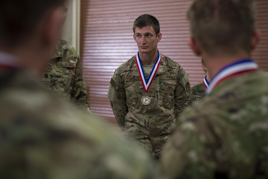 U.S. Air Force Staff Sgt. Dustin Strickland, 18th Weather Squadron forecaster, talks with leadership after an awards ceremony following Spartan Warrior week, April 15, 2016, at Avon Park, Fla. During Spartan Warrior week Airmen assigned to various squadrons across the U.S. competed against one another for medals, bragging rights and a trophy. (U.S. Air Force photo by Airman 1st Class Janiqua P. Robinson/Released)