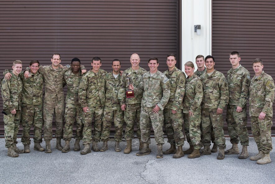 U.S. Air Force Col. Joseph Locke 93d Air Ground Operations Wing commander, poses for a photo with Airmen assigned to the 20th Air Support Operations Squadron, April 15, 2016, at Avon Park, Fla. The 20th ASOS won Spartan Warrior week taking home bragging rights and a trophy. (U.S. Air Force photo by Airman 1st Class Janiqua P. Robinson/Released)