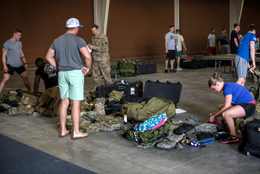 U.S. Air Force Airmen assigned to various units in the 93d Air Ground Operations Wing ensure they have all items to participate in Spartan Warrior week, April 15, 2016, at Avon Park, Fla. Participants were graded on the efficiency of their team when they arrived, including the accuracy of their paperwork and accountability of all items. (U.S. Air Force photo by Airman 1st Class Janiqua P. Robinson/Released)