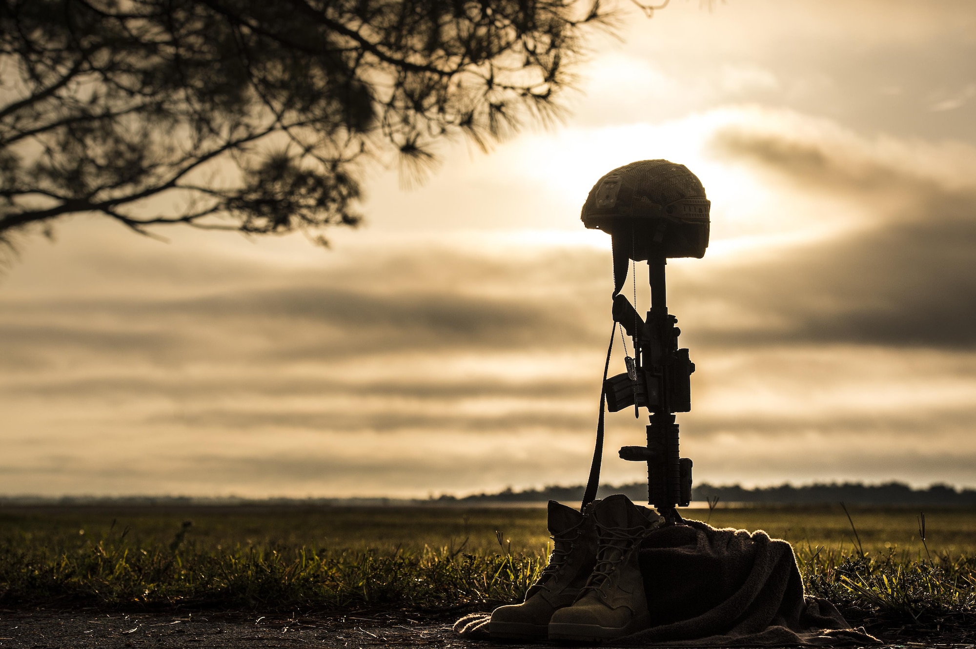 A battle cross sits on display during sunrise, April 15, 2016, at Avon Park Air Force Range, Fla. U.S. Air Force Airmen from the 93d Air Ground Operations Wing set up the cross for Lt. Col. William Schroeder, who was killed April 8. (U.S. Air Force Photo by Senior Airman Ryan Callaghan/Released)
