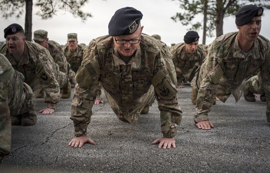 U.S. Air Force Master Sgt. David Brown, 820th Base Defense Group jumpmaster, performs pushups as a tribute to fallen Terminal Air Control Party Airmen, April 15, 2016, at Avon Park Air Force Range, Fla. The Airmen gathered to pay tribute to Lt. Col William Schroeder, who served alongside many members of the 93d AGOW. (U.S. Air Force Photo by Airman 1st Class Janiqua Robinson/Released)
