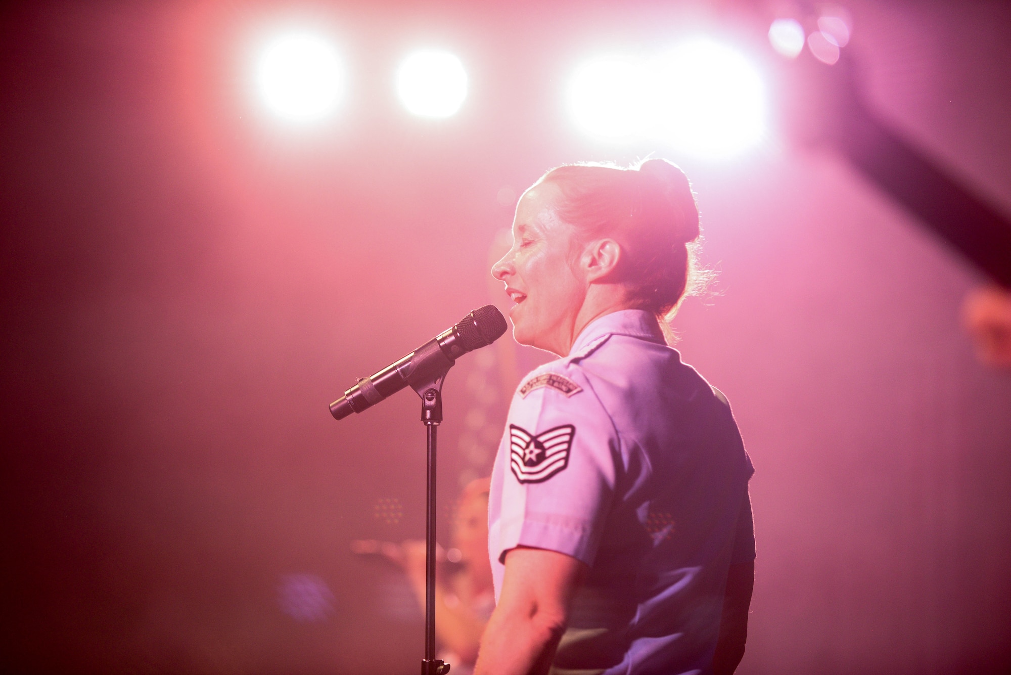U.S. Air Force Tech. Sgt. Rebecca Packard, a vocalist with the U.S. Air Force Heartland of America Band, sings for students during a concert at Aurora Public Schools April 13, 2016, in Aurora, Neb. In addition to engaging community concerts, the band provides patriotic music and fanfares for military ceremonies, important civic events, and conducts educational clinics throughout Nebraska. (U.S. Air Force photo by Zachary Hada)
