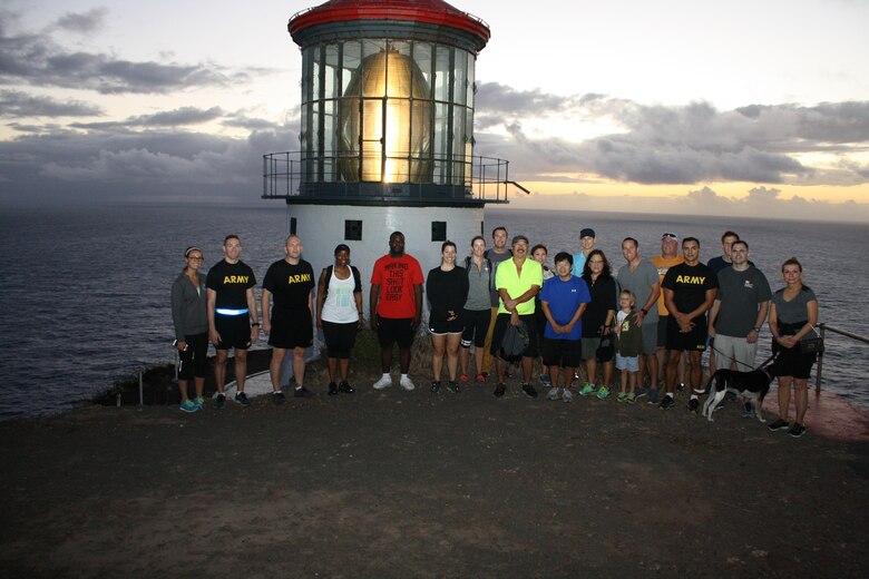 Makapu'u Point, Hawaii (April 15, 2016) -- Led by Honolulu District Commander Lt. Col. Christopher Crary (third from left), District Deputy Commander Maj. Brennan Wallace (second from right), and Pacific Ocean Division Command Sgt. Maj. Yolanda Tate (fourth from left), more than 25 District teammates, friends and families and Pacific Ocean Division employees, hiked to Oahu's Makapu'u Lighthouse to view the sunrise on April 15 in celebration of the 111th anniversary of the District’s founding. 