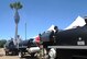 U.S. Airmen grill hamburgers and hotdogs during the annual DM50 Picnic at Davis-Monthan Air Force Base, Ariz., April 16, 2016. The picnic provided all D-M AFB Airmen, civilians and families with free food, entertainment, and activities. (U.S. Air Force photo by Airman Nathan H. Barbour/Released)