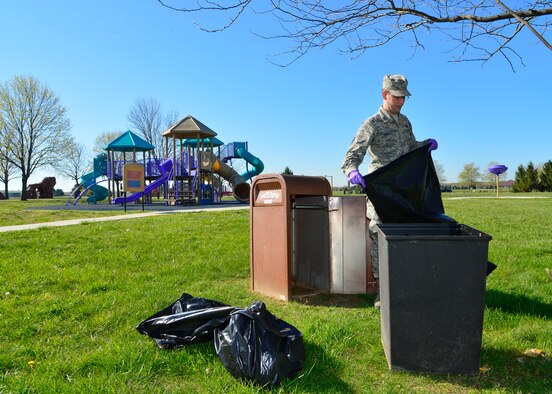 Airman 1st Class Josh Bridges, 436th Communications Squadron client systems technician, changes the trash at the Eagles Nest park during a spring cleanup event April 18, 2016, at Dover Air Force Base, Del. The park was cleaned of any trash and fallen tree limbs. (U.S. Air Force photo/Senior Airman William Johnson)