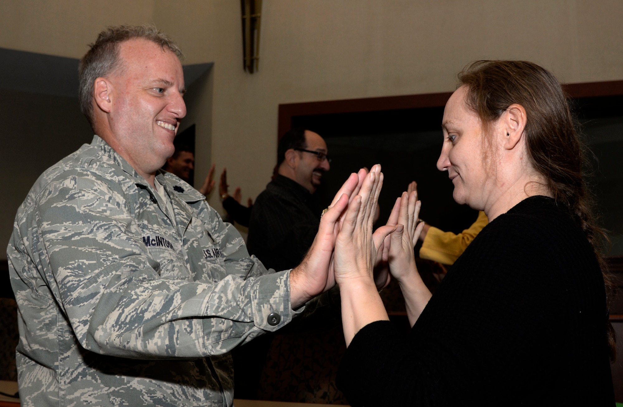 Lt. Col. Andrew McIntosh, left, a wing chaplain assigned to the 6th Air Mobility Wing (AMW), practices a team exercise with LeAnn Throlson, a community support coordinator assigned to the 6th AMW, during a Green Dot training session at MacDill Air Force Base, Fla., April 19, 2016. The Green Dot program focuses on the prevention of power-based interpersonal violence, which includes not only sexual violence, but also domestic violence, dating violence, stalking, child abuse, elder abuse, and bullying. (U.S. Air Force photo by Tech. Sgt. Krystie Martinez)